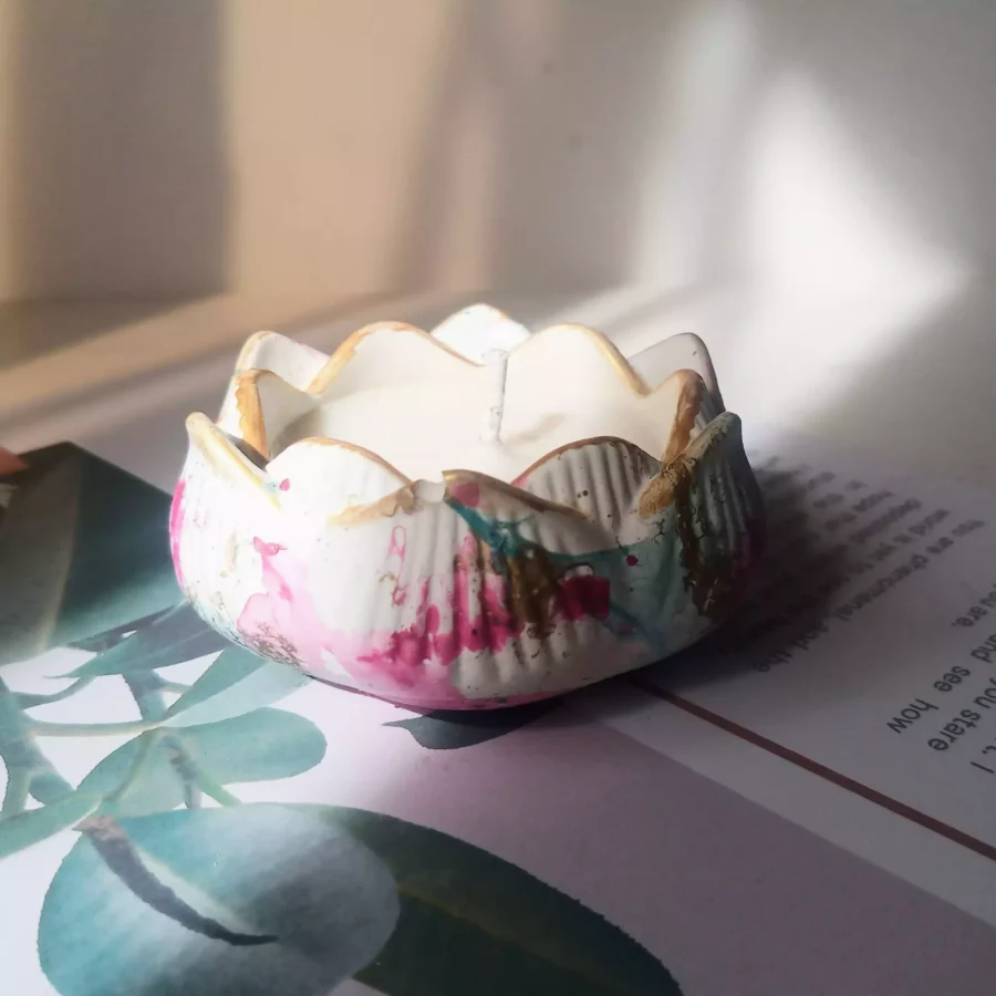 Luxury soy candle in a lotus-designed concrete jar